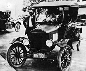 Matt Washington and his taxi, 1925